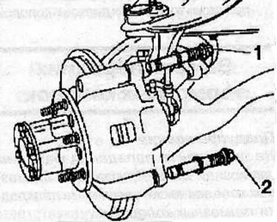 Apply special lubricant to the lock bolt (2), guide bolt (1) and into the brake shoe guide holes.