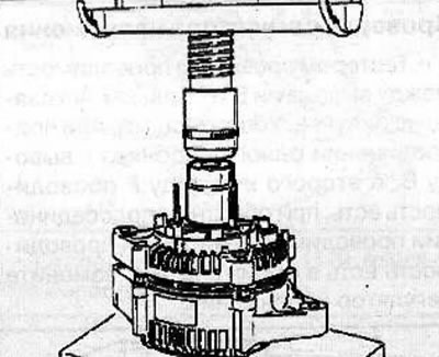 Using a press and socket wrench, install the rotor with the generator cover from the rectifier…
