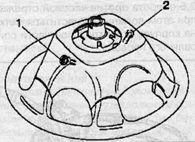 Install the airbag on the steering wheel and secure it with 2 screws (1 and 2), tightening them to…