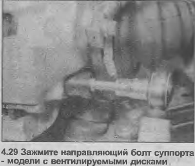 29. Install the caliper on the bracket and tighten the guide bolts to the specified tightening…