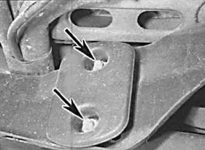 2. Remove the outer bolt securing the upper control arm to the rear beam.