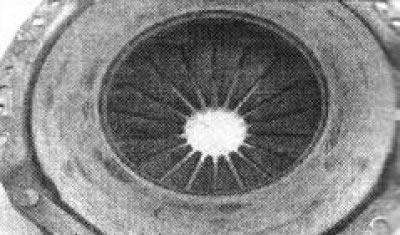 6.12b The friction surface of the pressure plate should be checked for cracks, grooves, deep…