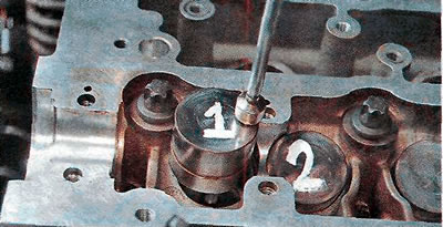 6. Using a magnet, remove the hydraulic tappets from the mounting holes.