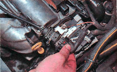 4. Disconnect the black wiring harness connector.
