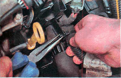 10. Disconnect the wiring harness from the holder bar.