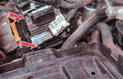 11. Using a TORX T20 key, unscrew the two front ECU mounting bolts.