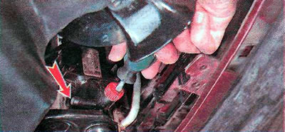 3. Using a slotted screwdriver, unscrew the radiator drain valve of the cooling system by several…