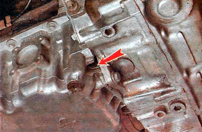 2) at the bottom of the joint between the clutch housing and the engine cylinder block; the…