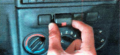 2. Use a screwdriver to pry up and remove the switch button.