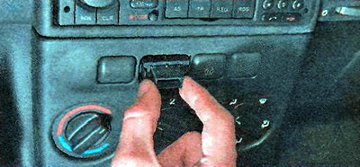 3. Squeeze the clamps and remove the switch.