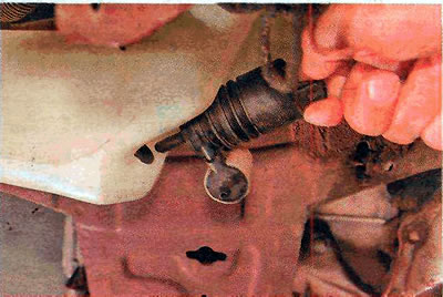 6. Remove the pump from the washer reservoir.