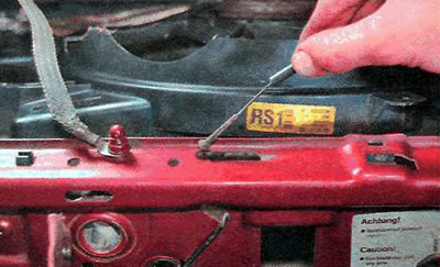 5. Remove the drive cable from the hole in the frame of the front panel shield.