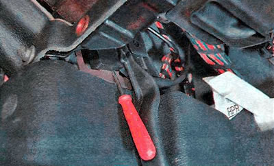 7. Using two thin slotted screwdrivers...