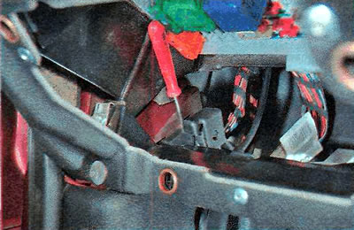 ...we move the front part of the handle bracket away from the body.