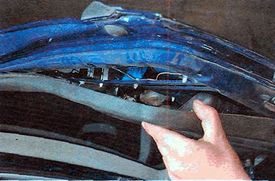 7. Pulling down, remove the upholstery, overcoming the resistance of the holders...