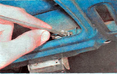 ...and disconnect the rod from the lock.